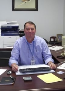 Man sitting behind desk